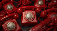 a group of red telephones on a black background